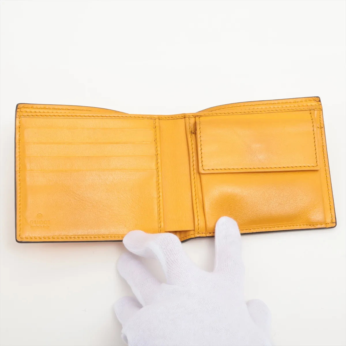 Gucci GG Logo Embossed Leather Compact Wallet Yellow
