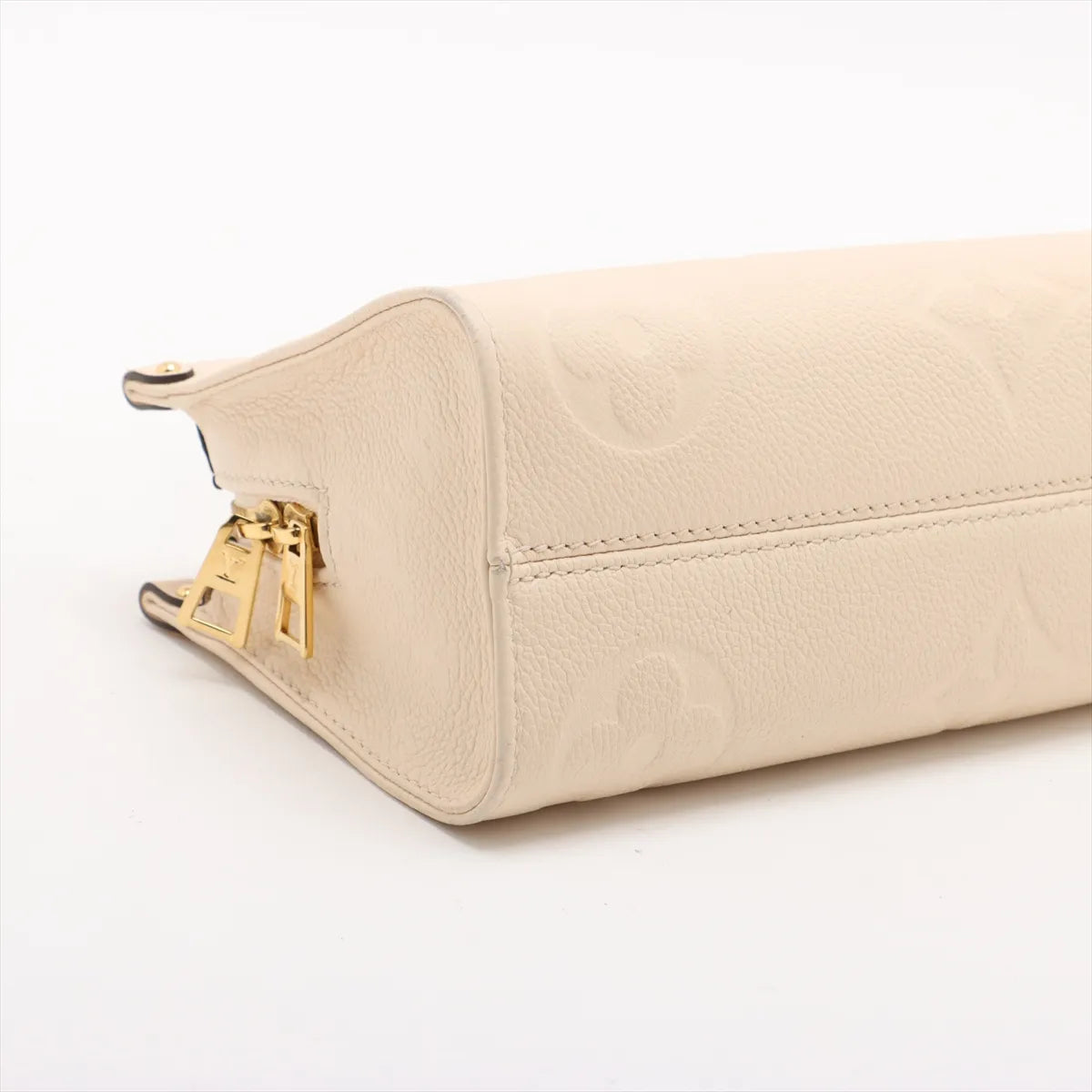 Louis Vuitton Monogram Empreinte OnTheGo East West Creme