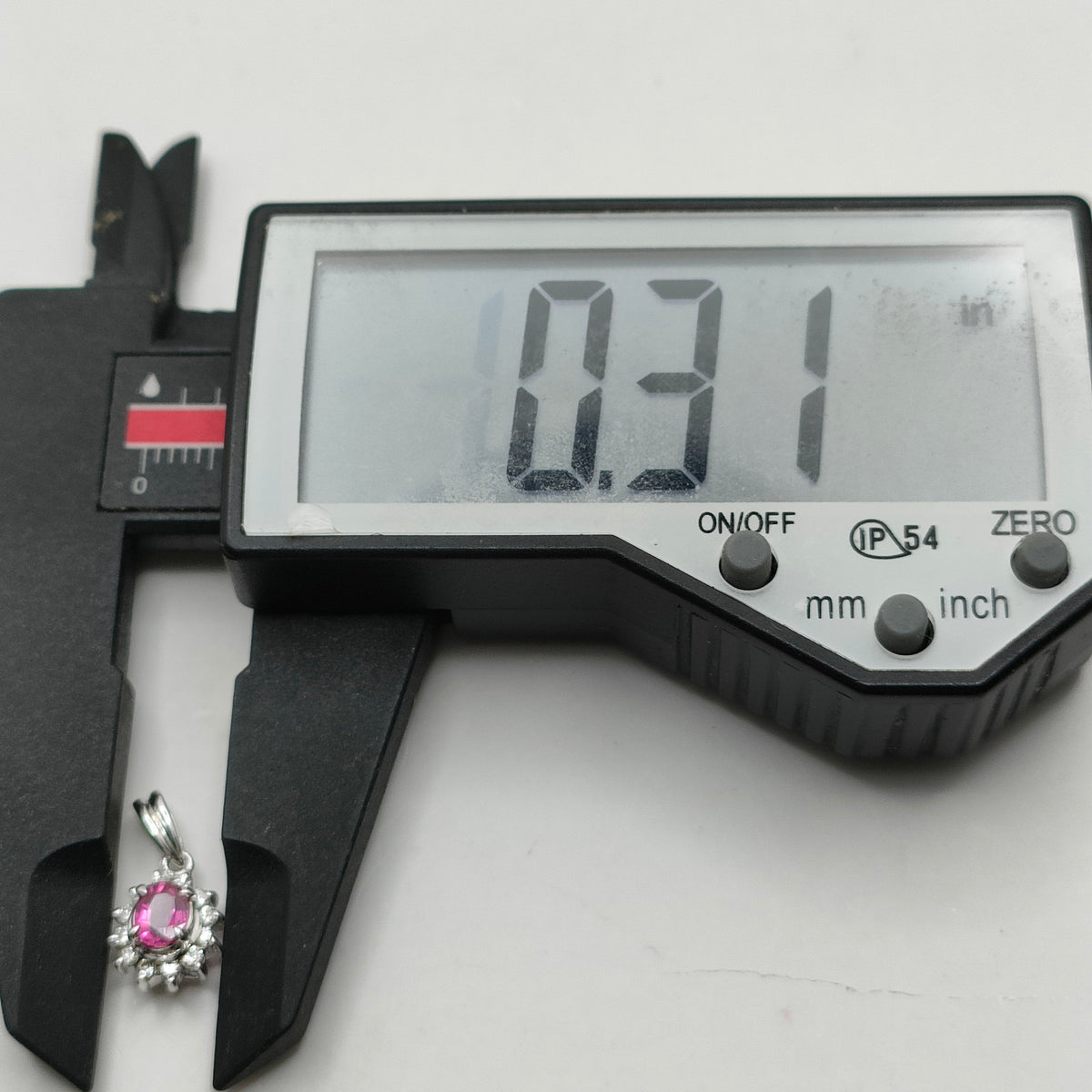 Platinum ruby and diamond halo pendant width measurement