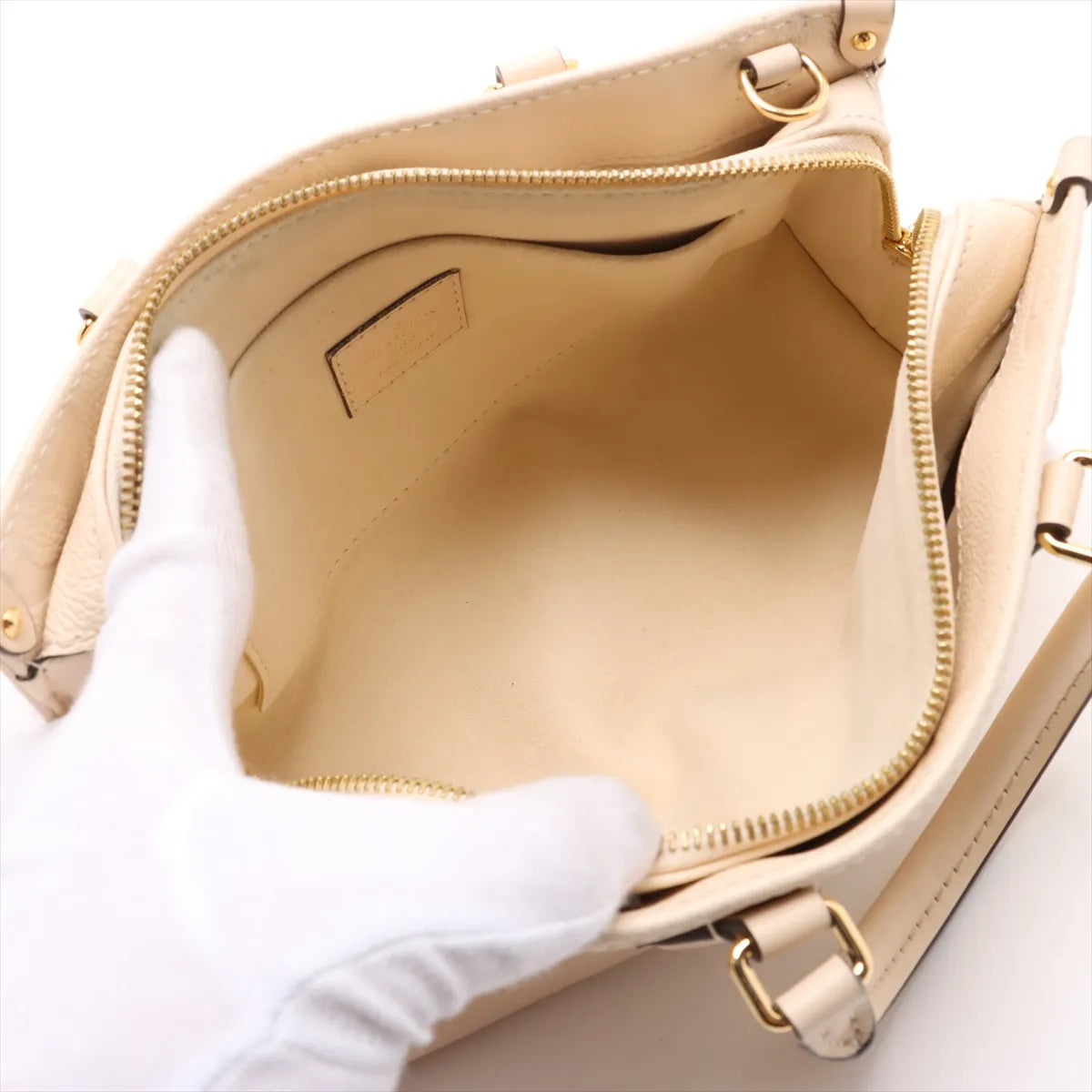 Louis Vuitton Monogram Empreinte OnTheGo East West Creme