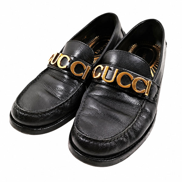 Gucci Black Leather Gold Logo Loafers — 37.5