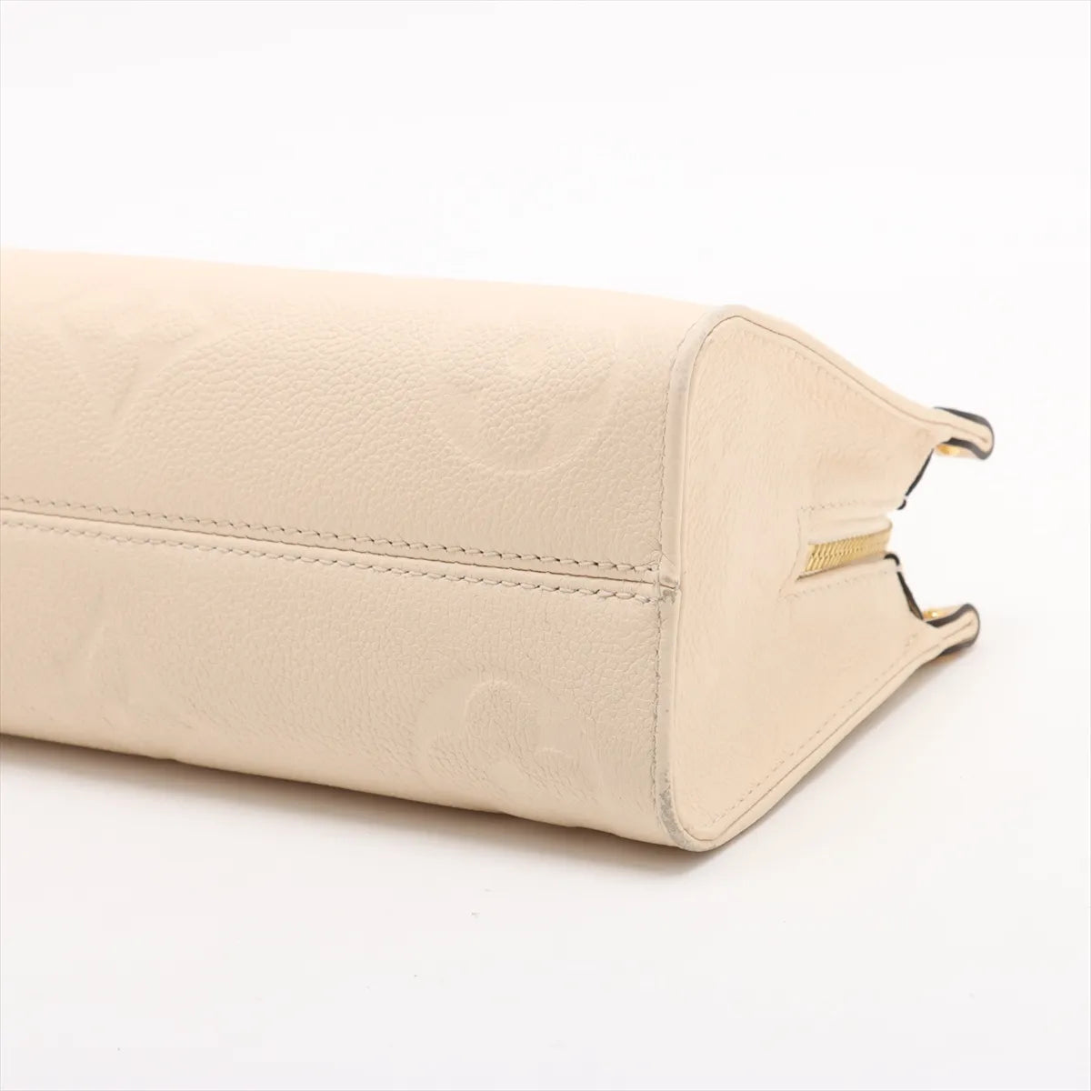 Louis Vuitton Monogram Empreinte OnTheGo East West Creme