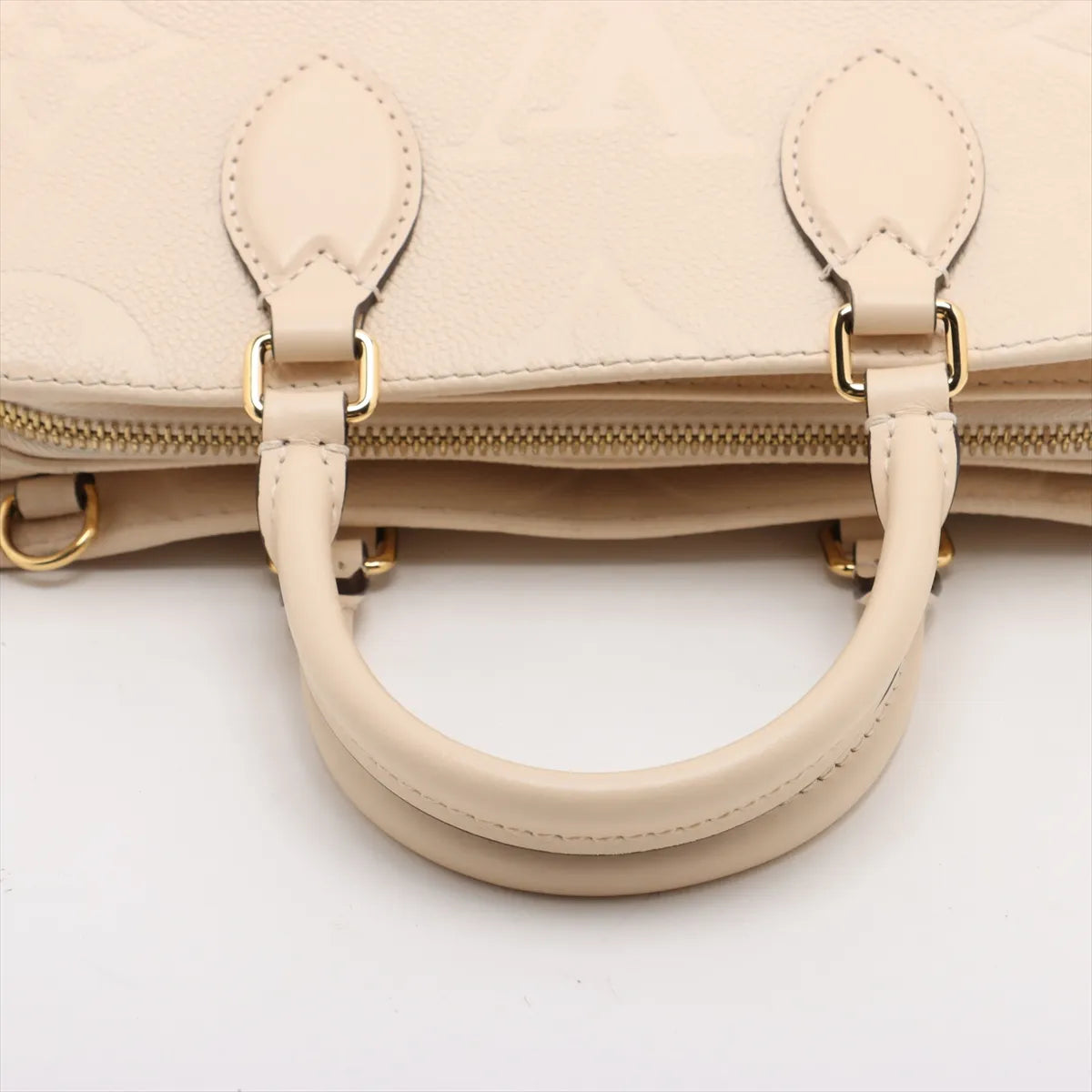 Louis Vuitton Monogram Empreinte OnTheGo East West Creme