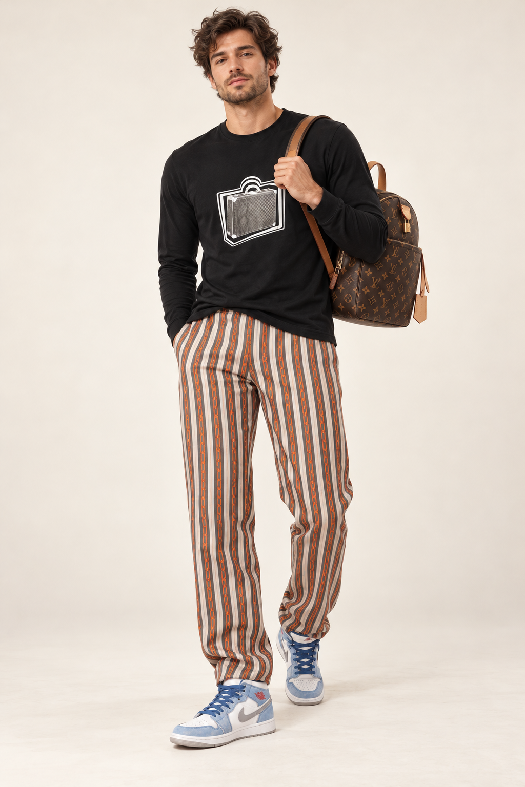 The Luggage Edit: Louis Vuitton Luggage tee, chain print pants and backpack with Nike Air Jordans