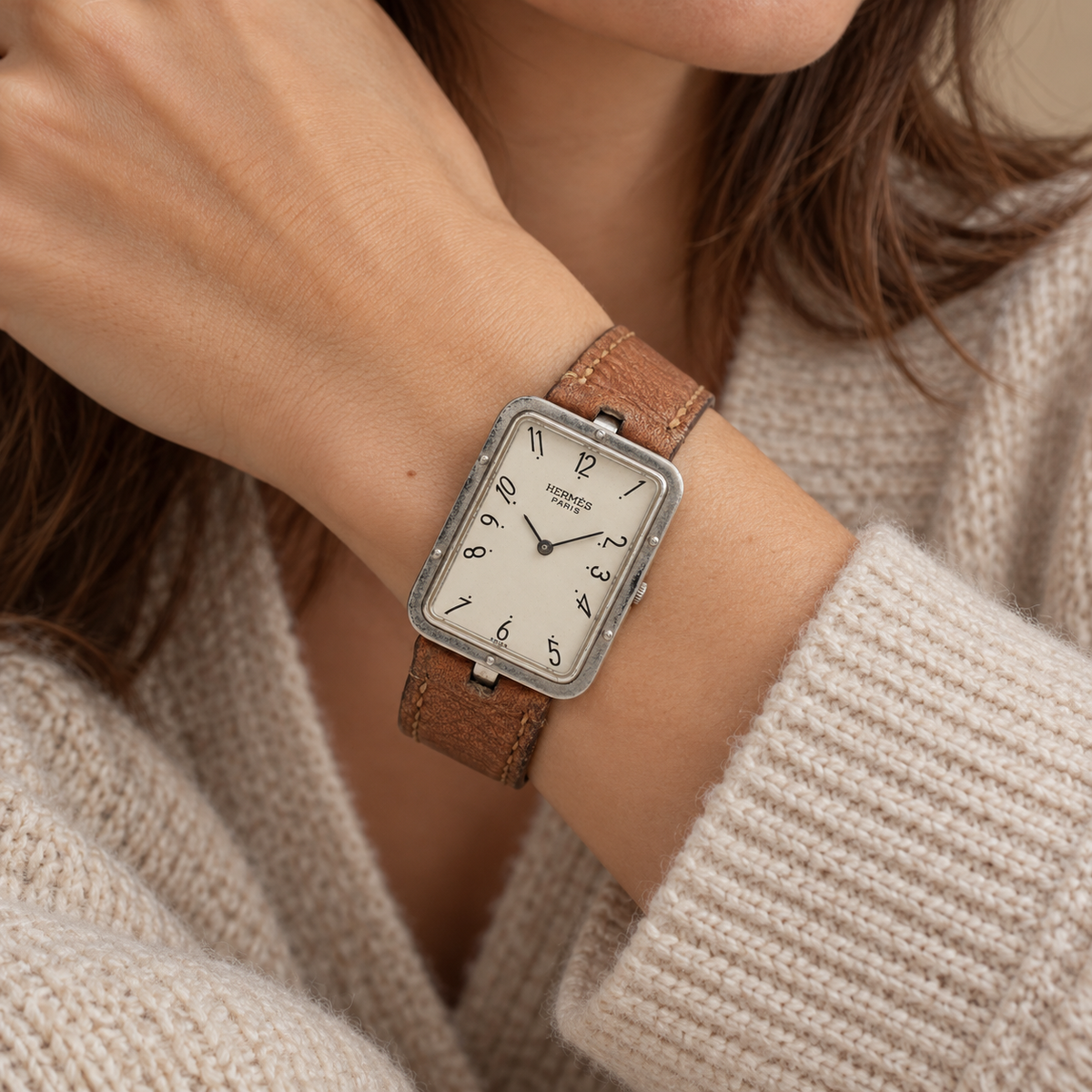 AI-generated styling illustration of Hermès Croisière Rectangular Quartz Watch — Brown Leather; refer to actual item photo for condition and dimensions