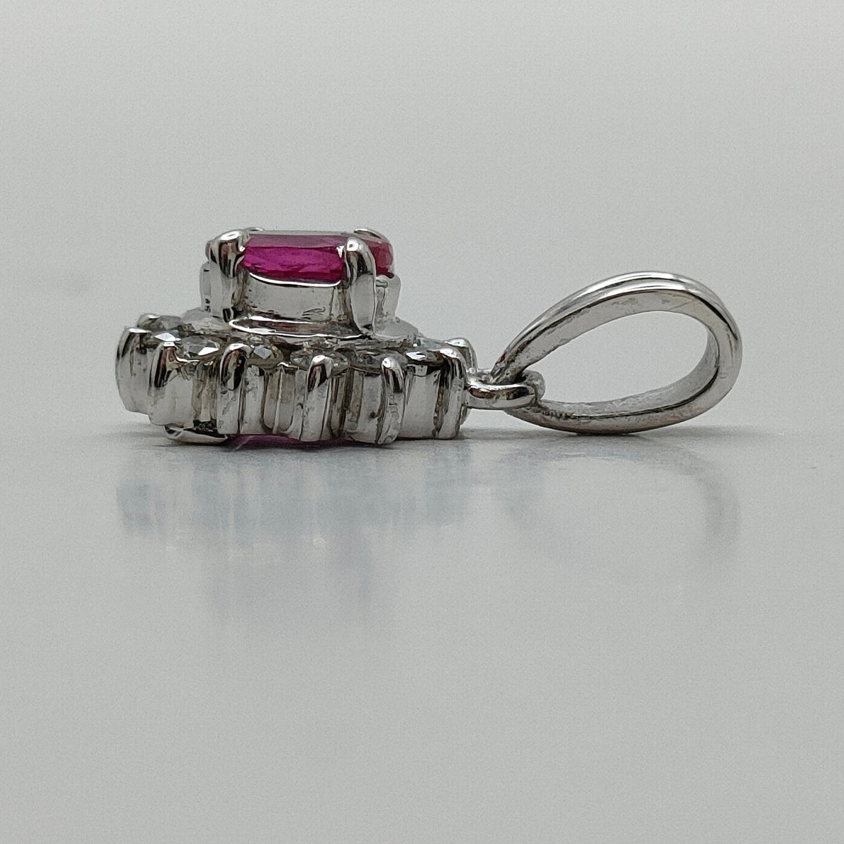 Platinum ruby and diamond halo pendant profile
